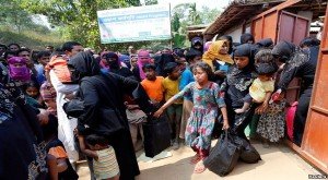Rohingya refugees collect aid supplies including food and medicine, sent from Malaysia, at Kutupalang Unregistered Refugee Camp in Cox’s Bazar, Bangladesh. -- File photo