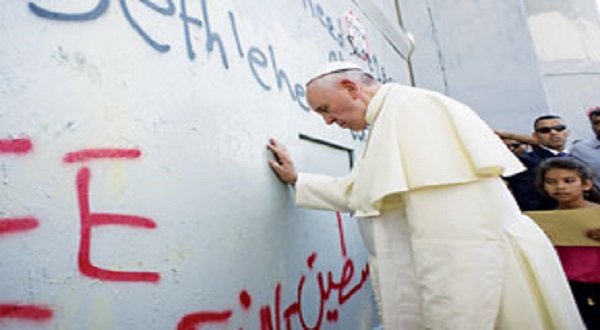 Pope Francis during his first visit to Bethlehem, the birthplace of Jesus Christ, stops to pray at Israel's Separation Wall that encircles Palestinian Territories.    