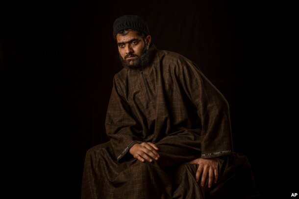 Firdous Ahmas Dar poses for a portrait in the village of Sopore, Indian-controlled Kashmir, Dec. 1, 2016. Firdous, 25, lost vision in both eyes after Indian troops used shotguns to spray hundreds of metal pellets to quell an anti-India protest in the troubled Himalayan region.