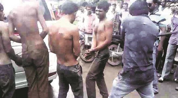 Dalit cow skinners being beaten up by the self appointed 'gau rakshaks' (cow protectors) in Gujarat. 