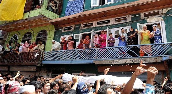 Women wail as the funeral procession of 20-year old Riaz Ahmed Shah passes through Srinagar. AFP  