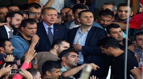 Turkish President Tayyip Erdogan is seen amid his supporters at the Ataturk Airport in Istanbul, Turkey July 16, 2016 after a military coup attempt. REUTERS/Huseyin Aldemir