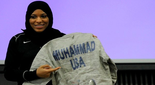 US fencing champion Ibtihaj Muhammad shows off her jersey. 
