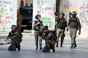 Israeli soldiers take positions to fire towards Palestinian&nbsp;&hellip;