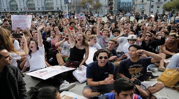 Students hold a sit-in in front of City Hall protesting the election of Republican Donald Trump as President of the United States in San Francisco, California, U.S. November 10, 2016. REUTERS/Elijah Nouvelage