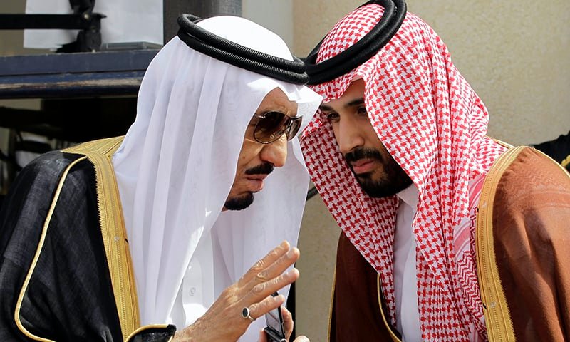 Then Crown Prince Salman bin Abdul-Aziz Al Saud, left, speaks with his son Prince Mohammed as they wait for Gulf Arab leaders ahead of the opening of Gulf Cooperation Council summit in Riyadh, Saudi Arabia. —AP/File