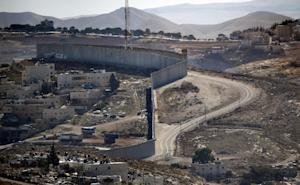 Part of the Israeli separation barrier divides a hill&nbsp;&hellip;