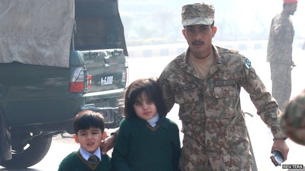 Soldiers help evacuate children