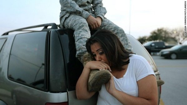 Luci Hamlin and her husband, Spc. Timothy Hamlin, wait to get back to their home at Fort Hood after a shooting at the Texas Army post on Wednesday, April 2. .