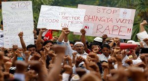 Rohingya refugees from Myanmar shout slogans as they hold placards during a rally, calling for a stop to the killings and violence toward Rohingyas in Myanmar, in Kuala Lumpur in this June 17, 2012 file photo. To match Special Report MYANMAR-EXODUS/ REUTERS/Bazuki Muhammad/Files (MALAYSIA - Tags: CIVIL UNREST)