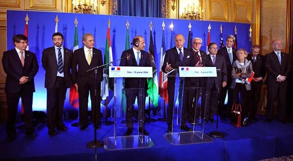 French Foreign Minister Laurent Fabius (5th L) speaks at a news conference held at the French foreign ministry during a “Friends of Syria” meeting ahead of Geneva II peace talks, in Paris, on Jan. 12.–Xinhua
