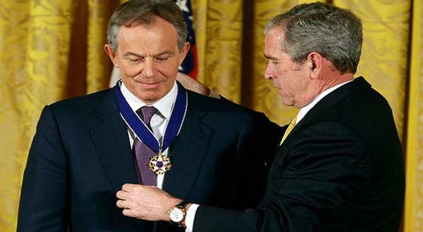 US President George W Bush decorates Tony Blair with Medal of Freedom at White House.