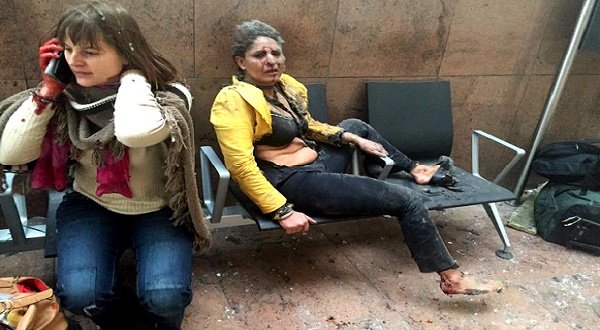 In this photo provided by Georgian Public Broadcaster and photographed by Ketevan Kardava two women wounded in Brussels Airport in Brussels, Belgium, after explosions were heard Tuesday, March 22, 2016. A developing situation left at least one person and possibly more dead in explosions that ripped through the departure hall at Brussels airport Tuesday, police said. All flights were canceled, arriving planes were being diverted and Belgium's terror alert level was raised to maximum, officials said. (Ketevan Kardava/ Georgian Public Broadcaster via AP)