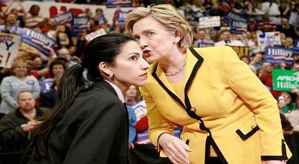 Huma Abedin with US presidential candidate Hillary Clinton.  Abedin is the highest paid staffer in US presidential campaign. AP photo