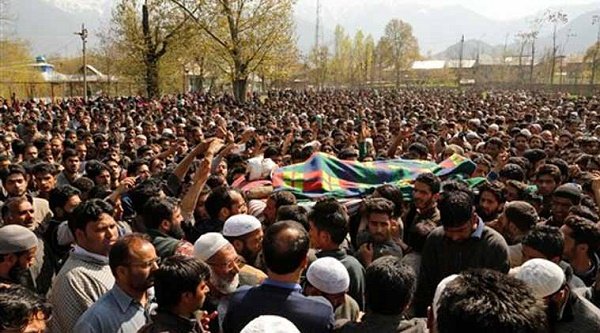 Kashmiri Muslim villagers carry the body of Khaled Muzaffar, a civilian during his funeral procession in Tral, some 38 Kilometers (24 miles) south of Srinagar, Indian controlled Kashmir, Tuesday, April 14, 2015. AP
