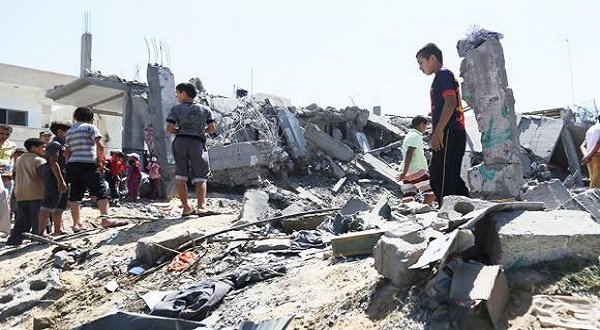 ANOTHER DAY IN GAZA...Palestinians inspect the rubble of a house after it was hit by an Israeli missile strike in Khan Younis, Gaza Strip. AP 
