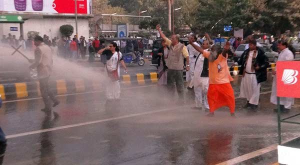 Dalit protesters protesting against atrocities on the community are water-cannoned on the way to parliament.