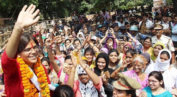 Richa Singh waves to her supporters after being elected the first female president of the Allahabad University Students Union. 