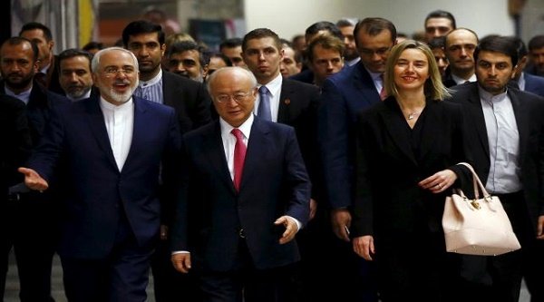 Iranian Foreign Minister Javad Zarif, International Atomic Energy Agency (IAEA) Director General Yukiya Amano and the High Representative of the European Union for Foreign Affairs and Security Policy Federica Mogherini (front L-R) arrive at the United Nations building in Vienna, Austria, January 16, 2016. REUTERS/Leonhard Foeger