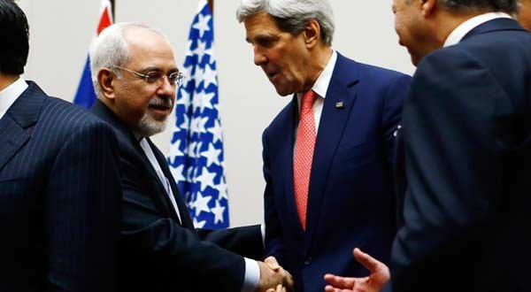 Iranian Foreign Minister Mohammad Javad Zarif shakes hands with US Secretary of State John Kerry in Geneva on Nov. 24, 2013. --Reuters photo