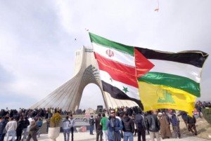 A man carries a giant flag made of flags of Iran, Palestine, Syria and Hezbollah, during a ceremony marking the 37th anniversary of the Islamic Revolution, in Tehran February 11, 2016. REUTERS/Raheb Homavandi/TIMA
