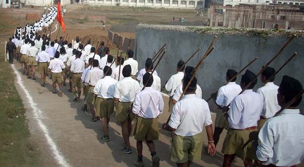 RSS workers march wielding sticks. Photo by Azad Singh Parihar