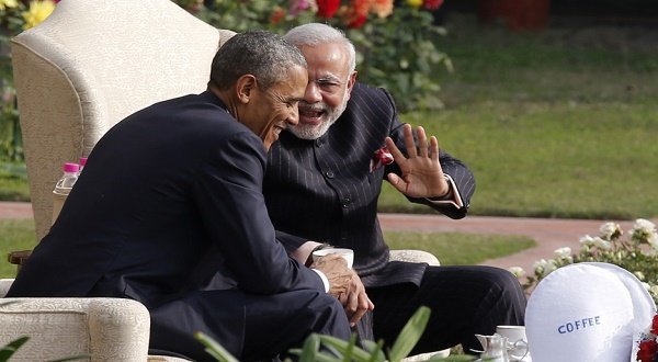 US President Barack Obama and Indian Prime Minister, Narendra Modi, talk as they have coffee and tea together in the gardens of Hyderabad House in New Delhi on January 25, 2015. Credit: Jim Bourg/Reuters