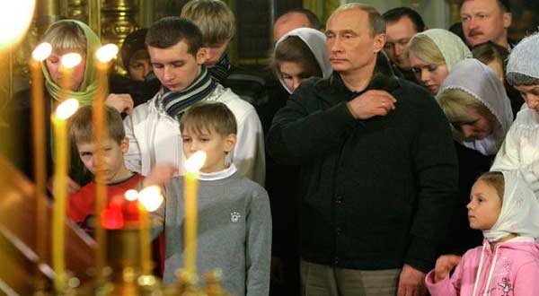 President Putin of Russia attends a church service.