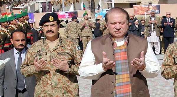 Pakistan Prime Minister Nawaz Sharif and Army Chief General Raheel Sharif pray at martyrs' memorial during their visit at Quetta Cantonment on  January 30, 2014.   PPI Images