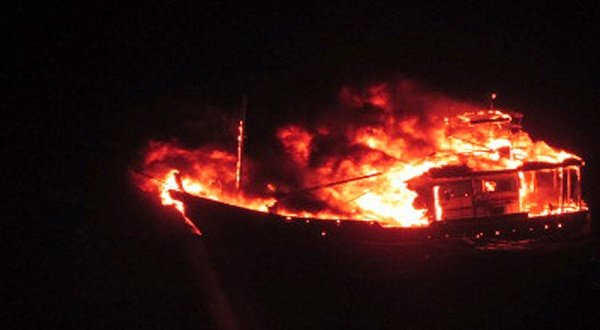 This handout photograph released by the Indian Ministry of Defence, is said to show a burning vessel off the coast of the western Indian state of Gujarat in the Arabian Sea early on January 1, 2015. - AFP photo