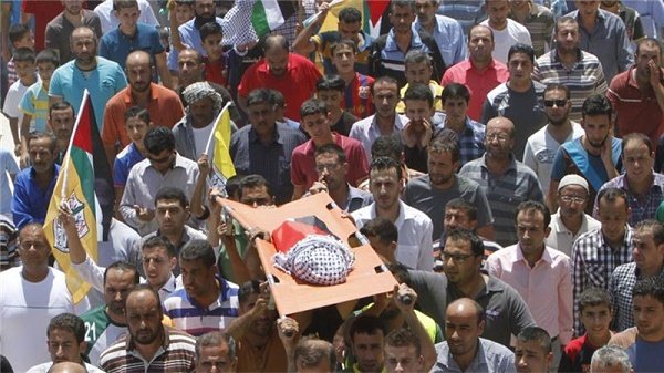 Palestinians accompany the body of 18-month old Ali Dawabsha on his last journey.  The UN says at least 120 attacks by Israeli settlers have been documented in the occupied West Bank since the beginning of 2015. Reuters    