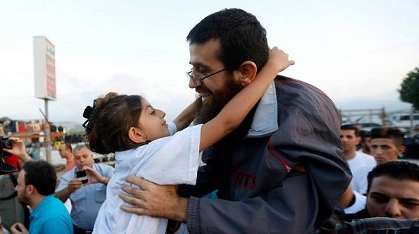 Khader Adnan being welcomed by his daughter. Google image