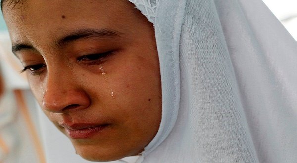 A Myanmar Muslim mourns her uncle who was killed in rioting on Thursday in Mandalay. Reuters photo. 