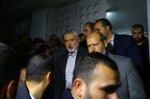Senior Hamas leader Ismail Haniya (centre) leaves a morgue in Gaza City after Mazen Faqha was killed (AFP)