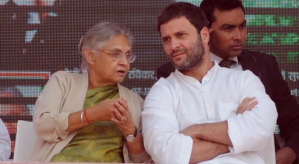 Delhi chief minister Sheila Dikshit with Congress Vice President Rahul Gandhi at a rally in New Delhi.--IANS