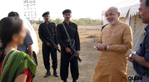 Chief Minister Narendra Modi engaged in a conversation with ‘Madhuri’ Soni even as the then Kachchh Collector Pradeep Sharma and Modi’s security personnel look on. 