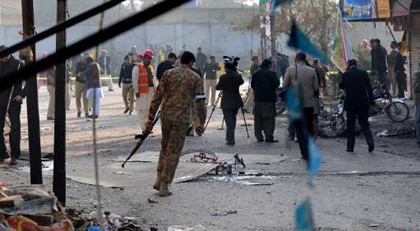 Pakistani security officials inspect the site of a bomb attack in Rawalpindi on January 20, 2014 --Photo courtesy AFP