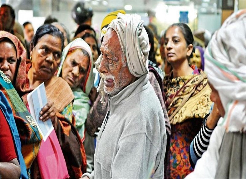An elderly man helplessly cries after being forced out of an ATM queue. The image in Hindustan Times went viral, capturing the chaos and frustration of millions over the Modi government's badly botched up recall of high currency notes. Image credit: Praveen Kumar/Hindustan Times