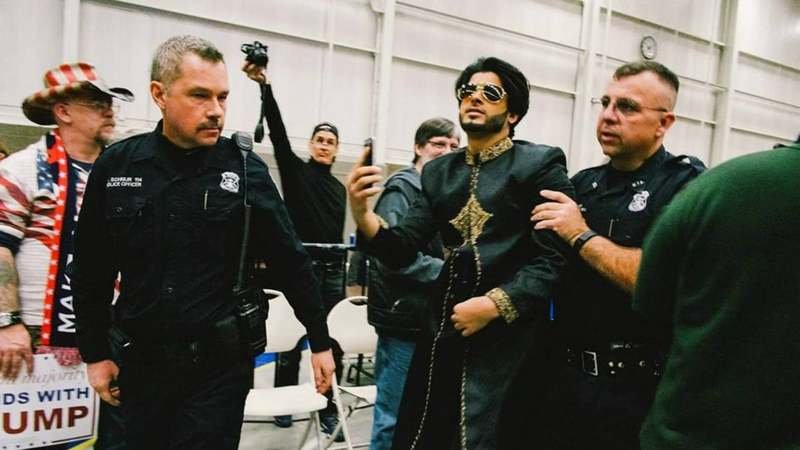 Saqib Javed being escorted out of a Trump rally in Michigan. Photo: Saqib&#039;s Facebook page