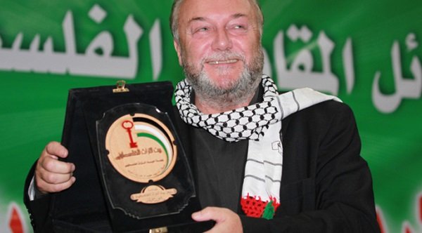 British MP George Galloway poses with a gift he received during his reception at the Arab Cultural Center in the Yarmouk refugee camp near Damascus, Syria, 05 October 2010. EPA/YOUSSEF BADAWI