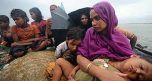 A group of Rohingya Muslims fleeing Myanmar on a boat.