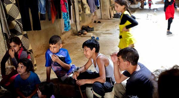 LOST INNOCENCE…Mahmoud with friends in an underground shelter in El Akbiya, Lebanon. Half of some 500 inhabitants of the dark underground shelter are children. Photo: UNHCR