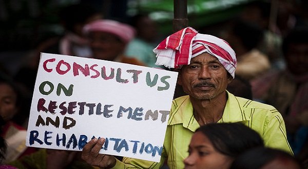 A man holds a sign as Indian farmers protested against the government's land acquisition policy in New Delhi. Credit: AFP/Getty Images  