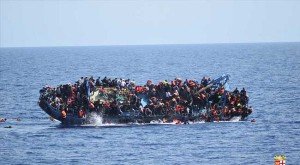 Migrants are seen on a capsizing boat before a rescue operation by Italian navy ships off the coast of Libya in this handout picture released by the Italian Marina Militare on May 25, 2016. (Reuters Photo)