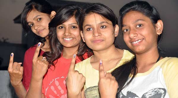 First time voters show their fore fingers marked with phosphoric ink after casting their votes during the third phase of 2014 Lok Sabha Polls in Jabalpur on April 10, 2014. IANS)
