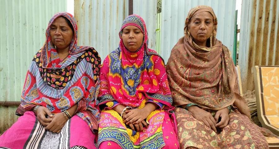 Family members of Ayyub, (Left to right) Mehraj banu (mother), Afsana (sister), Khehrunisa (aunty) waiting outside the postmortem room at VS Hospital, Ahmedabad on September 17. Credit: Damayantee Dhar