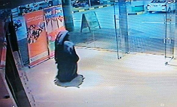 This image made from video released by the Abu Dhabi police department on Dec. 2, 2014 shows a veiled suspect in the stabbing of an American teacher in a shopping mall restroom as seen on security camera footage in Abu Dhabi, United Arab Emirates. (AP)