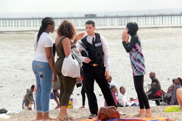 A social experiment team tests the public's reaction to a police officer arresting a woman for wearing a burkini on a UK beach